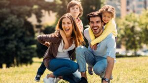 mom dad son and daughter outside