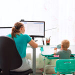 Mother with kid working from home