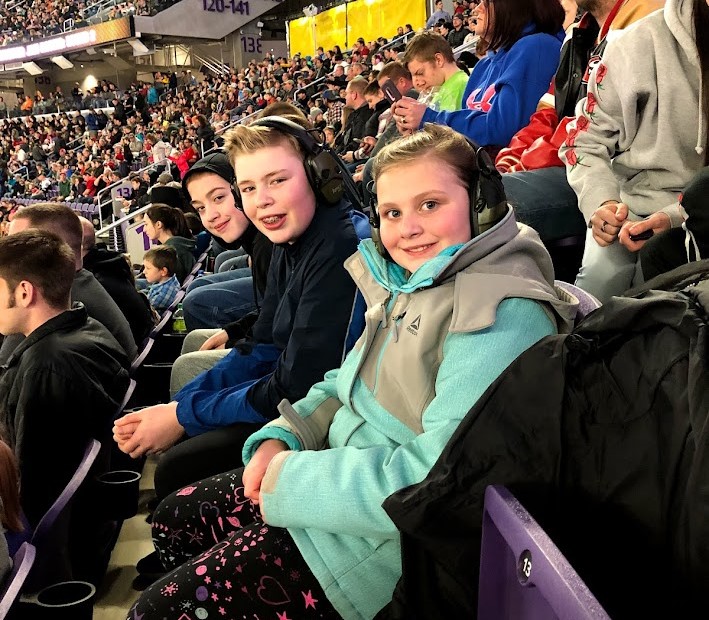 kids wearing noise cancelling headphones at monster jam in minneapolis