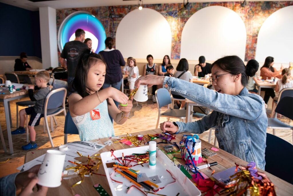 girl and mom creating in the studio at Minnesota children's museum 