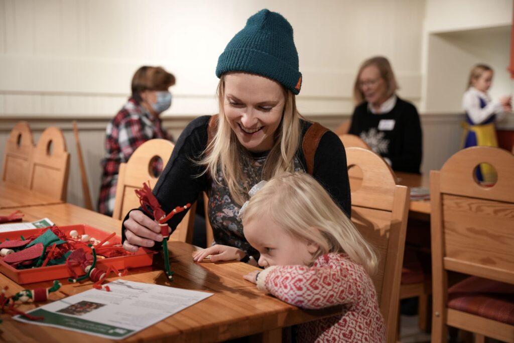 woman and girl playing holiday games ASI Holiday Exhibition